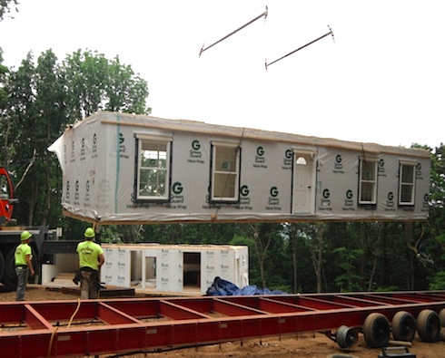 Modular home being assembled